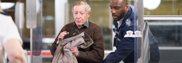 senior passenger at the airport screening checkpoint