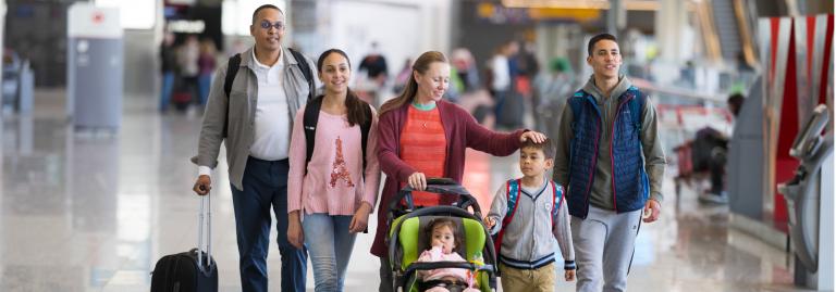 A family in an airport terminal.