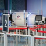 Divesting line and a CT X-ray machine at security screening. 